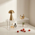 Minimalist acrylic display shelf for cups and cosmetics.